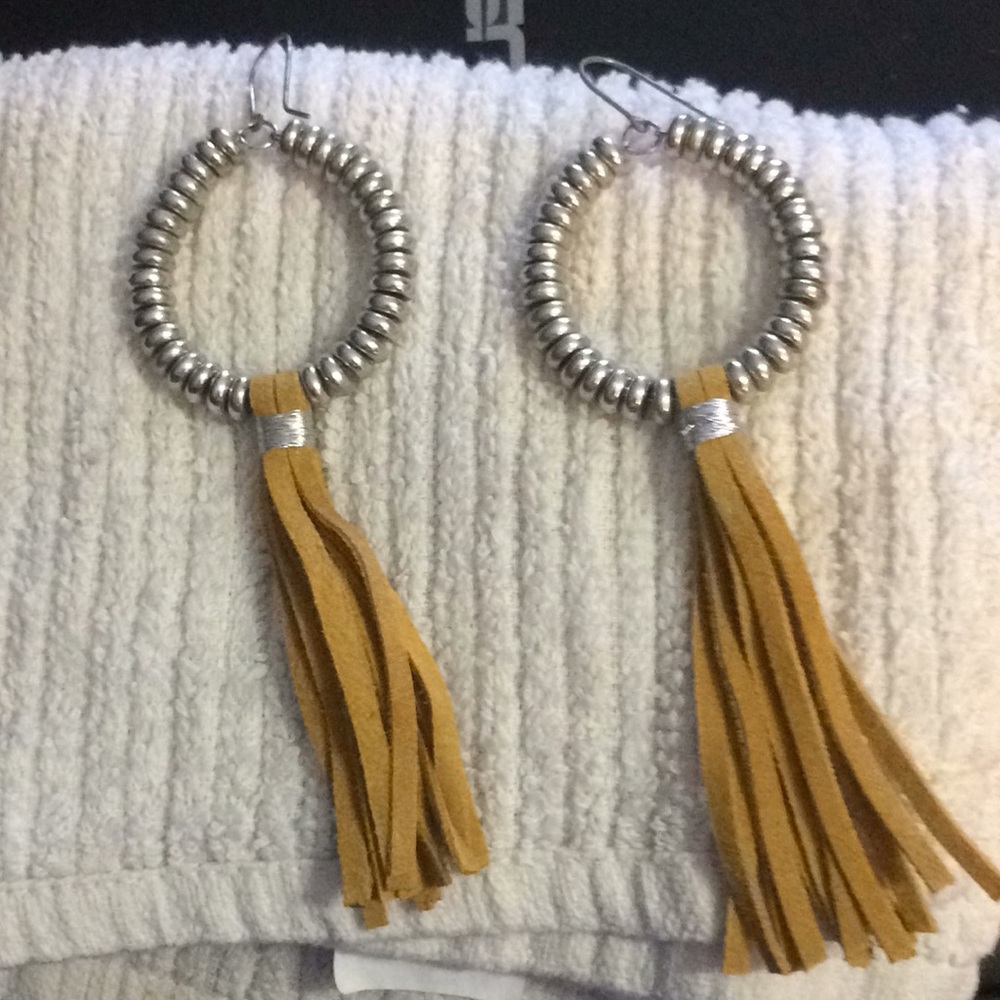 Earrings with leather fringe accents